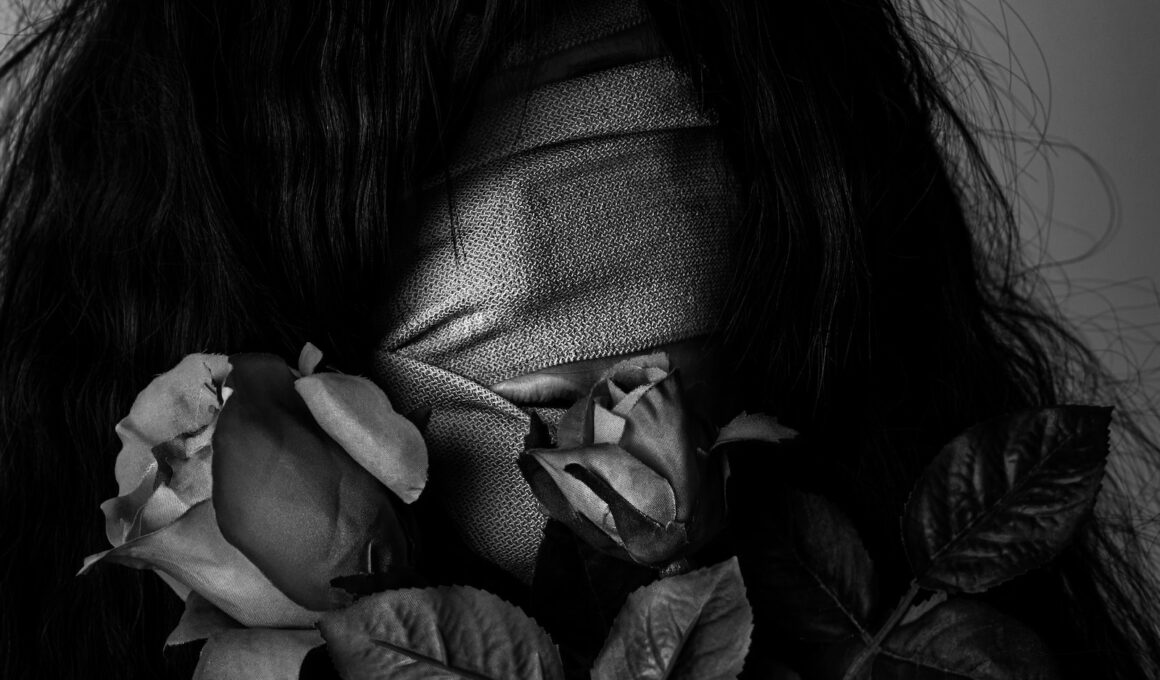 grayscale photography of woman covered by strap
