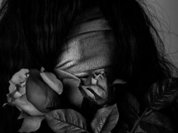grayscale photography of woman covered by strap
