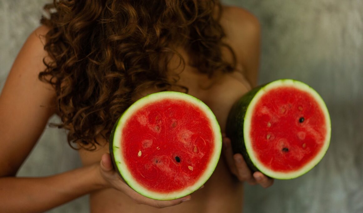 person holding sliced watermelon fruit