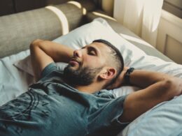 man lying on bed