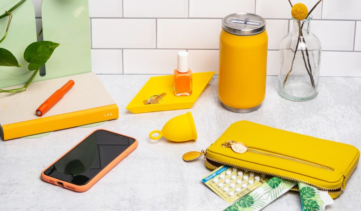 a table topped with a cell phone and a yellow case
